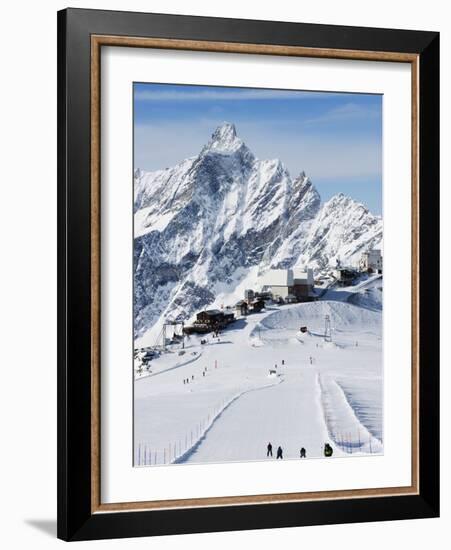 Skiers, Mountain Scenery in Cervinia Ski Resort, Cervinia, Valle D'Aosta, Italian Alps, Italy-Christian Kober-Framed Photographic Print