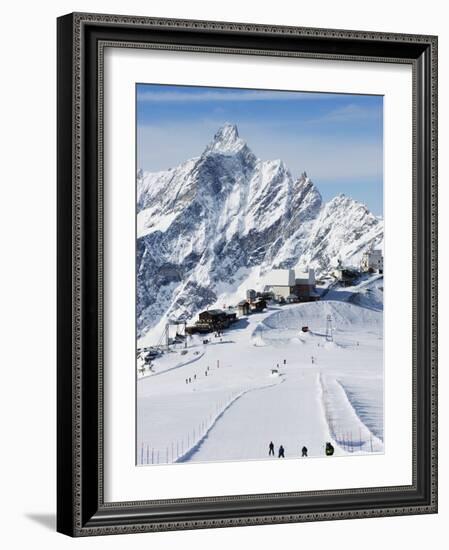 Skiers, Mountain Scenery in Cervinia Ski Resort, Cervinia, Valle D'Aosta, Italian Alps, Italy-Christian Kober-Framed Photographic Print