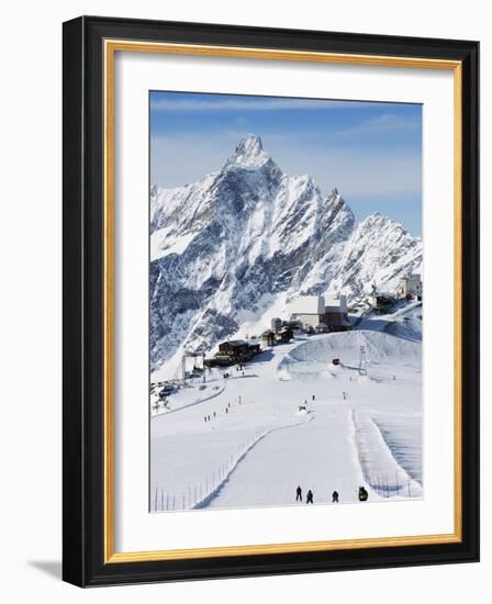 Skiers, Mountain Scenery in Cervinia Ski Resort, Cervinia, Valle D'Aosta, Italian Alps, Italy-Christian Kober-Framed Photographic Print