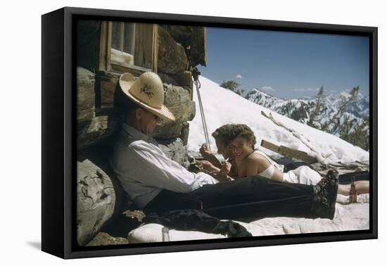 Skiers Smoking, Drinking and Sunbathing at Sun Valley Ski Resort, Idaho, April 22, 1947-George Silk-Framed Premier Image Canvas