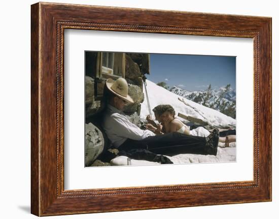 Skiers Smoking, Drinking and Sunbathing at Sun Valley Ski Resort, Idaho, April 22, 1947-George Silk-Framed Photographic Print