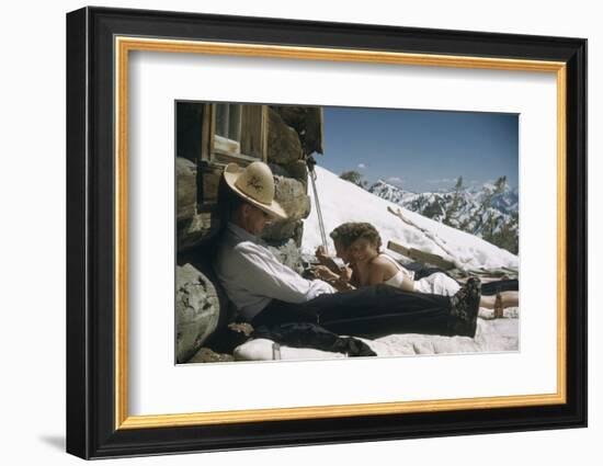 Skiers Smoking, Drinking and Sunbathing at Sun Valley Ski Resort, Idaho, April 22, 1947-George Silk-Framed Photographic Print