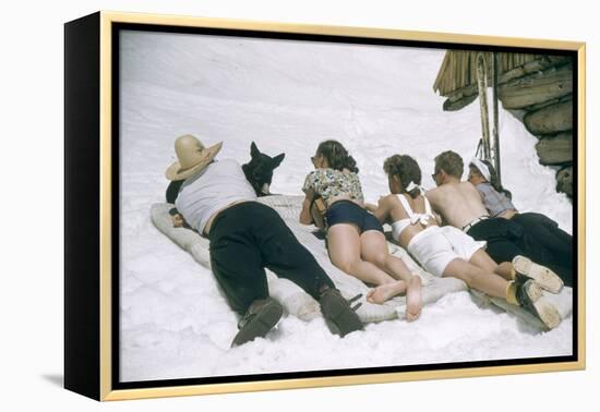 Skiers Sunbathing in Summer Fashions with Dog at Sun Valley Ski Resort, Idaho, April 22, 1947-George Silk-Framed Premier Image Canvas