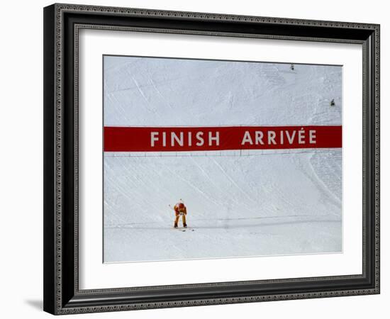 Skiier Arrives at the Finish Line-Paul Sutton-Framed Photographic Print