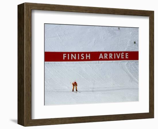 Skiier Arrives at the Finish Line-Paul Sutton-Framed Photographic Print