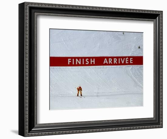 Skiier Arrives at the Finish Line-Paul Sutton-Framed Photographic Print