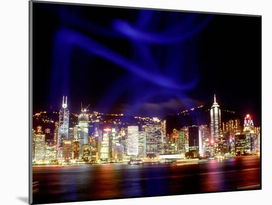 Skyline at Night Reflected in Victoria Harbour, Kowloon, Hong Kong-Russell Gordon-Mounted Photographic Print