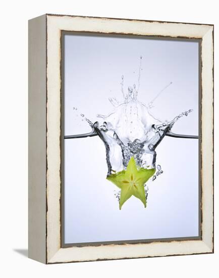 Slice of Carambola Falling into Water-Kröger & Gross-Framed Premier Image Canvas