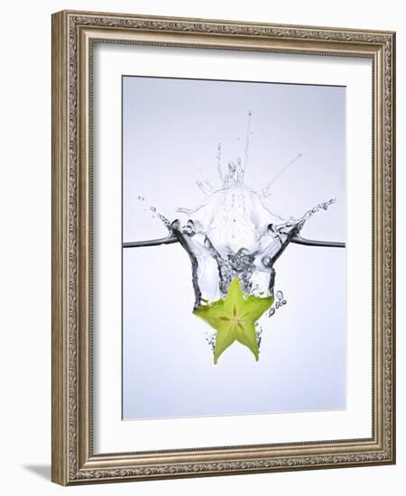 Slice of Carambola Falling into Water-Kröger & Gross-Framed Photographic Print