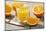 Sliced Oranges and Glass with Fresh Orange Juice-Jana Ihle-Mounted Photographic Print