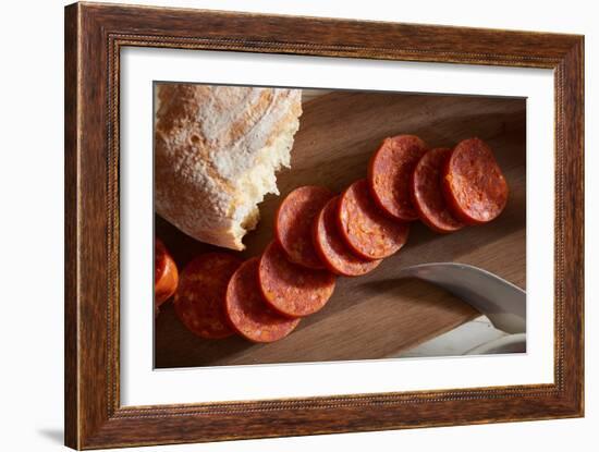 Sliced Pepperoni Shot Close On A Wooden Plate-Shea Evans-Framed Photographic Print