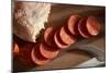 Sliced Pepperoni Shot Close On A Wooden Plate-Shea Evans-Mounted Photographic Print