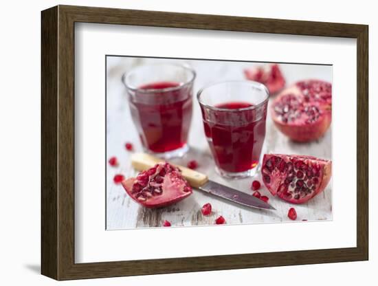 Sliced Pomegranates, Cores and Glasses with Pomegranate Juice-Jana Ihle-Framed Photographic Print