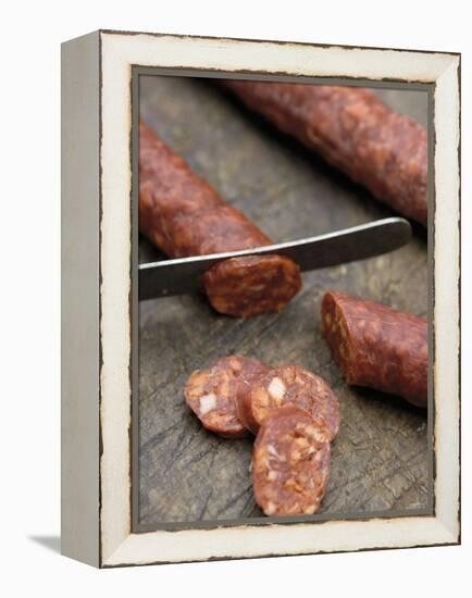 Slicing Chorizo-Winfried Heinze-Framed Premier Image Canvas