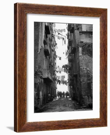 Slum Street with Laundry Hanging Between Buildings-Alfred Eisenstaedt-Framed Photographic Print