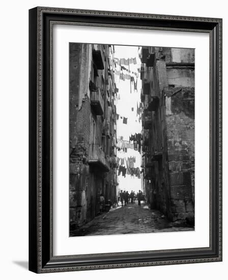 Slum Street with Laundry Hanging Between Buildings-Alfred Eisenstaedt-Framed Photographic Print