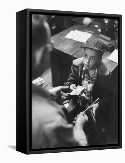 Small Boy Purchasing a Screwdriver at a Local Hardware Store-Robert W^ Kelley-Framed Premier Image Canvas