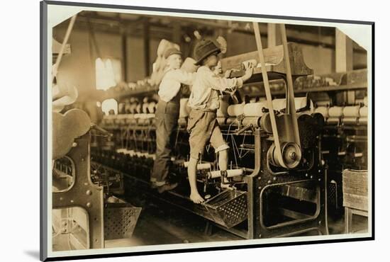 Small boys mend broken threads and replace empty bobbins at Bibb Mill, Macon, Georgia, 1909-Lewis Wickes Hine-Mounted Photographic Print