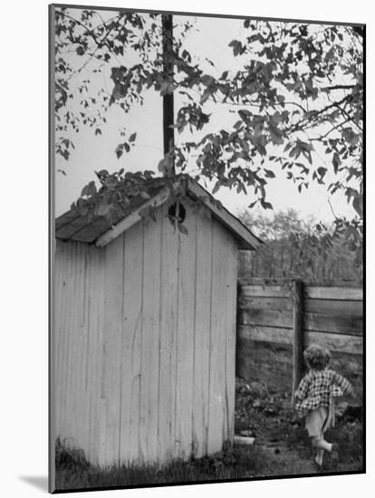 Small Child Running to the Outhouse at Rural School-Thomas D^ Mcavoy-Mounted Photographic Print
