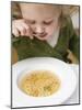 Small Girl Eating Soup with Teddy Bear Pasta-null-Mounted Photographic Print