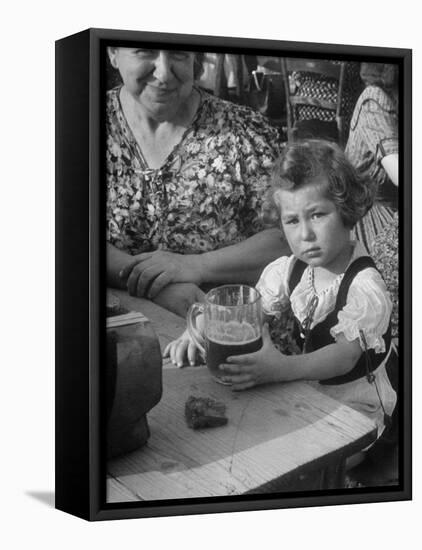 Small Girl Enjoying a Stein of Weak Beer-Dmitri Kessel-Framed Premier Image Canvas