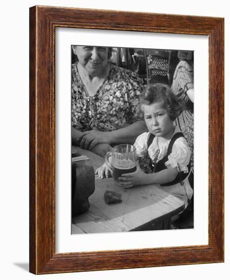 Small Girl Enjoying a Stein of Weak Beer-Dmitri Kessel-Framed Photographic Print