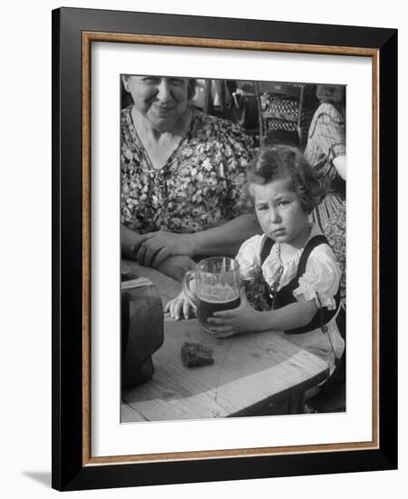 Small Girl Enjoying a Stein of Weak Beer-Dmitri Kessel-Framed Photographic Print