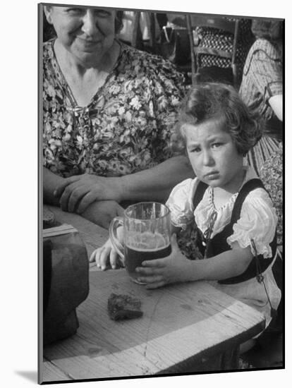 Small Girl Enjoying a Stein of Weak Beer-Dmitri Kessel-Mounted Photographic Print