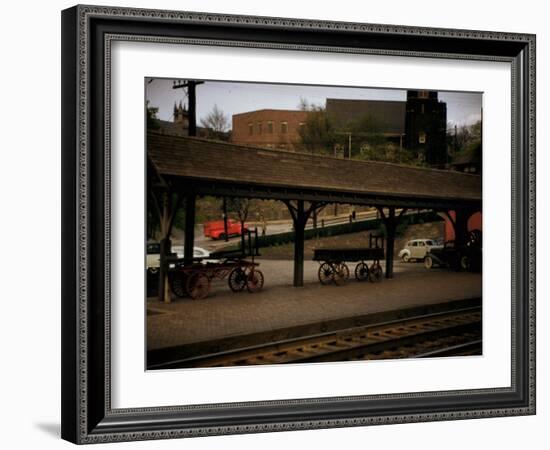 Small Railway Station with Wooden Buckboards for Baggage, Period Cars in Lot-Walker Evans-Framed Photographic Print