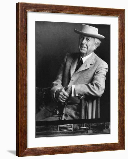 Smiling Architect Frank Lloyd Wright Seated While Wearing Hat-Alfred Eisenstaedt-Framed Premium Photographic Print