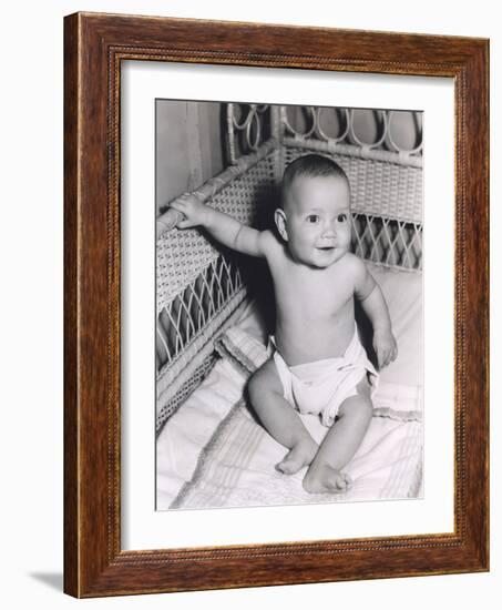 Smiling Baby Boy Sitting in Crib-null-Framed Photo