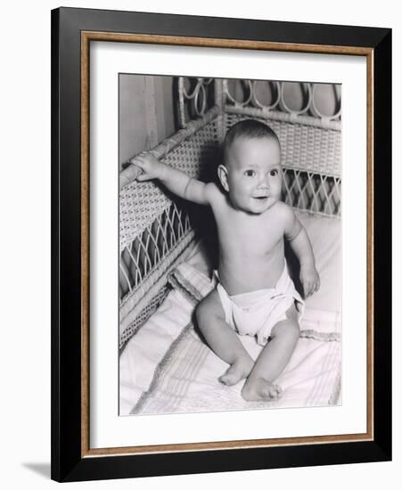 Smiling Baby Boy Sitting in Crib-null-Framed Photo