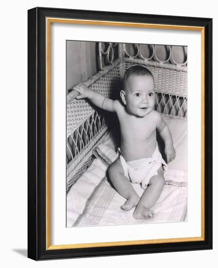 Smiling Baby Boy Sitting in Crib-null-Framed Photo