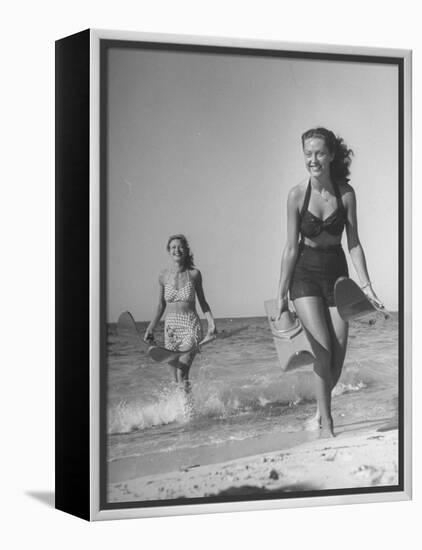 Smiling Girls Carrying Skis Out of the Water onto Beach-null-Framed Premier Image Canvas
