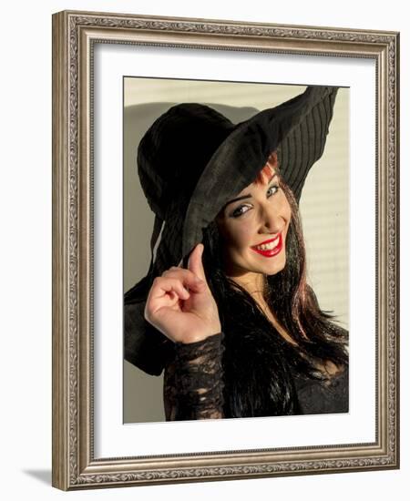 Smiling teenage girl in black hat-Charles Bowman-Framed Photographic Print