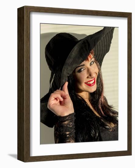 Smiling teenage girl in black hat-Charles Bowman-Framed Photographic Print