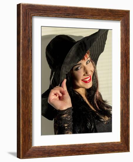 Smiling teenage girl in black hat-Charles Bowman-Framed Photographic Print