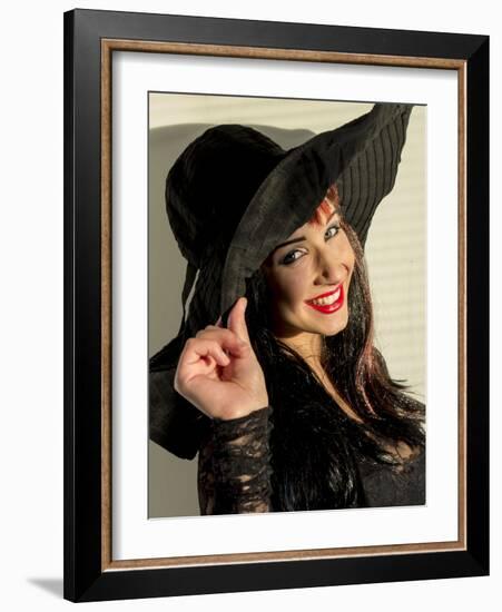 Smiling teenage girl in black hat-Charles Bowman-Framed Photographic Print