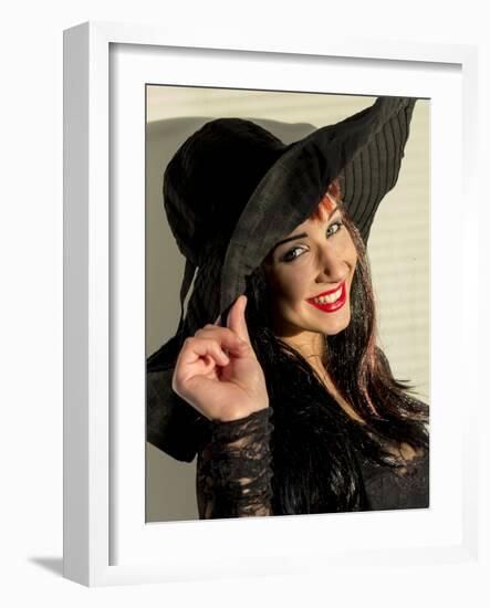 Smiling teenage girl in black hat-Charles Bowman-Framed Photographic Print