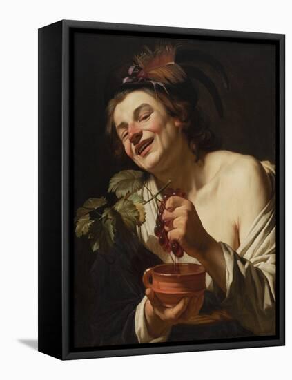 Smiling Young Man Squeezing Grapes, 1622 (Oil on Canvas)-Gerrit van Honthorst-Framed Premier Image Canvas