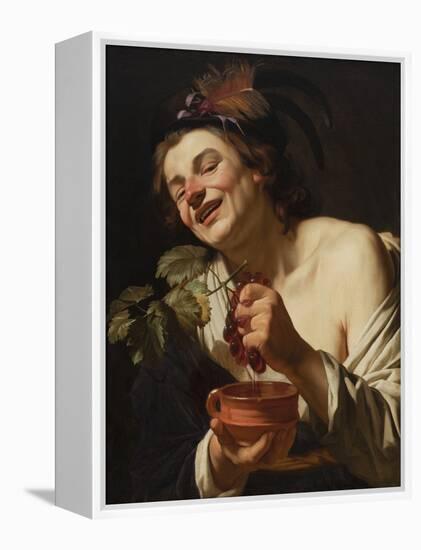 Smiling Young Man Squeezing Grapes, 1622 (Oil on Canvas)-Gerrit van Honthorst-Framed Premier Image Canvas
