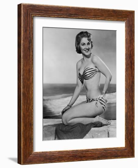 Smiling Young Woman Perches on a Stone Wall in a Striped Bikini-Charles Woof-Framed Photographic Print