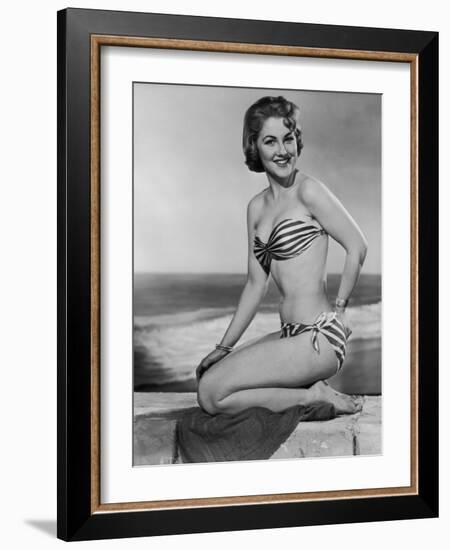 Smiling Young Woman Perches on a Stone Wall in a Striped Bikini-Charles Woof-Framed Photographic Print