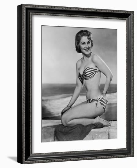 Smiling Young Woman Perches on a Stone Wall in a Striped Bikini-Charles Woof-Framed Photographic Print