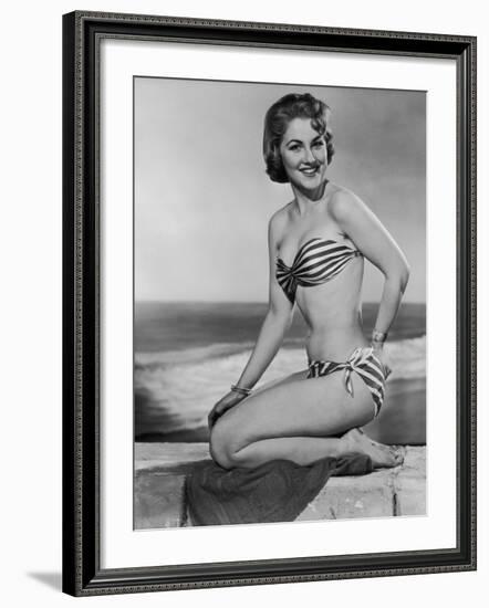 Smiling Young Woman Perches on a Stone Wall in a Striped Bikini-Charles Woof-Framed Photographic Print