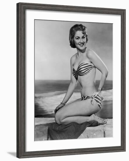 Smiling Young Woman Perches on a Stone Wall in a Striped Bikini-Charles Woof-Framed Photographic Print