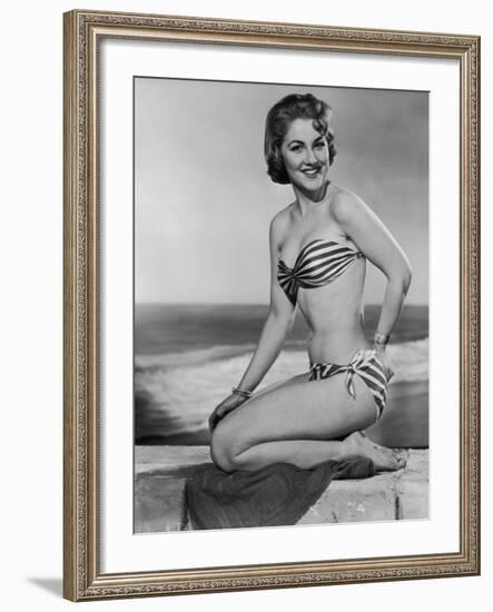 Smiling Young Woman Perches on a Stone Wall in a Striped Bikini-Charles Woof-Framed Photographic Print