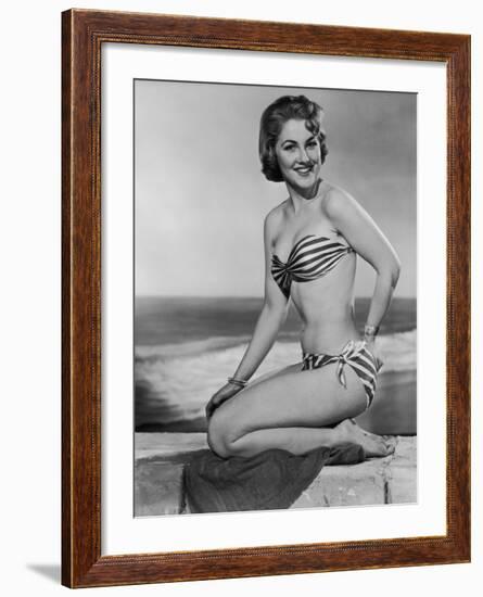 Smiling Young Woman Perches on a Stone Wall in a Striped Bikini-Charles Woof-Framed Photographic Print