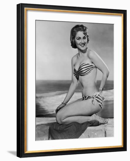Smiling Young Woman Perches on a Stone Wall in a Striped Bikini-Charles Woof-Framed Photographic Print