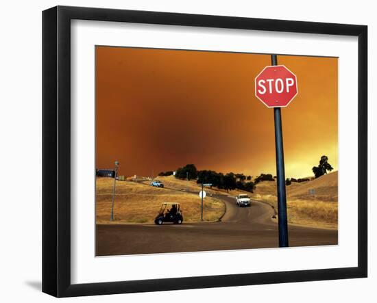 Smoke from a Wildfire Billows Over a Hillside-null-Framed Photographic Print